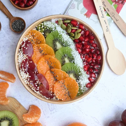 Colourful Bowl Therapy açaí bowl topped with kiwi, mandarin and pomegranate